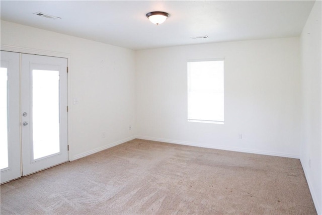 19105 Feather Hill Rd, Elkins, AR 72727 - unfurnished room featuring french doors, carpet floors, and baseboards