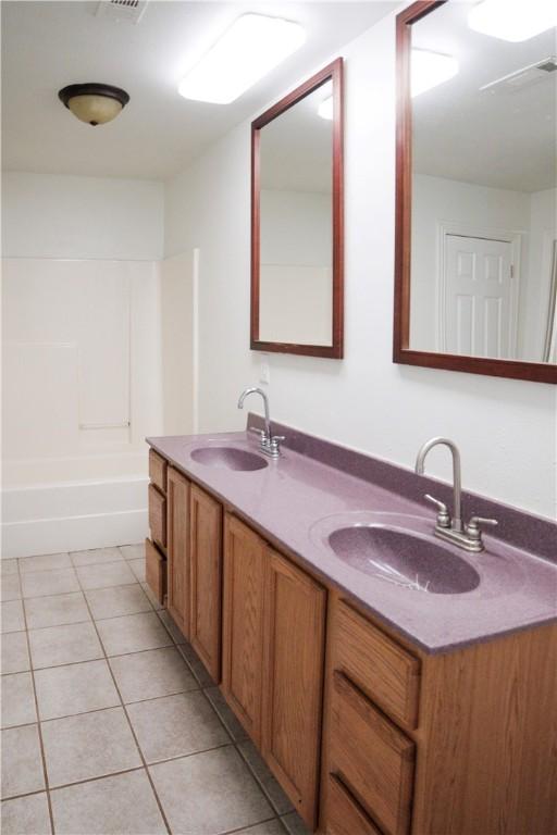 19105 Feather Hill Rd, Elkins, AR 72727 - bathroom featuring double vanity, tile patterned flooring, and bathtub / shower combination