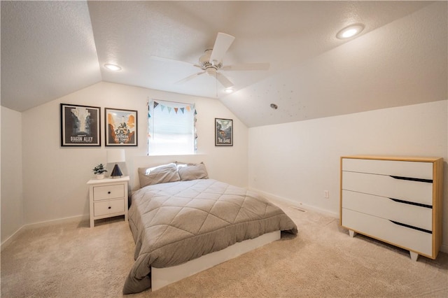 1205 NE 2nd St, Bentonville, AR 72712 - bedroom featuring light colored carpet, vaulted ceiling, ceiling fan, and a textured ceiling