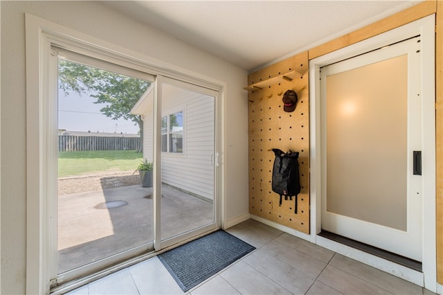 1205 NE 2nd St, Bentonville, AR 72712 - doorway to outside with tile patterned floors and baseboards