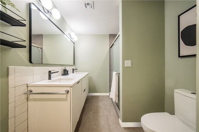 1205 NE 2nd St, Bentonville, AR 72712 - full bathroom with double vanity, a shower with door, and tile patterned floors