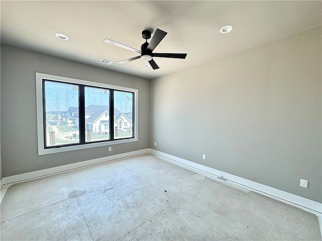 6702 SW Brilliance Ter, Bentonville, AR 72713 - spare room featuring baseboards, ceiling fan, recessed lighting, and concrete floors