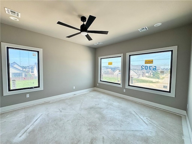 6702 SW Brilliance Ter, Bentonville, AR 72713 - empty room with concrete floors, baseboards, plenty of natural light, and ceiling fan