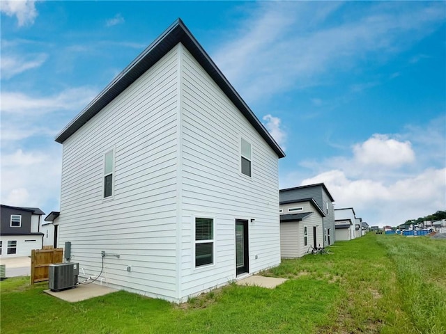 841 States Ave, Bentonville, AR 72713 - rear view of property featuring central AC and a yard
