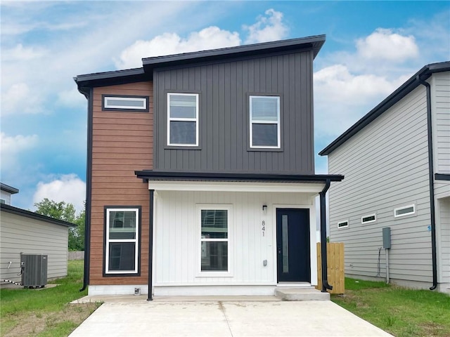 841 States Ave, Bentonville, AR 72713 - modern home featuring central air condition unit, a patio, and board and batten siding