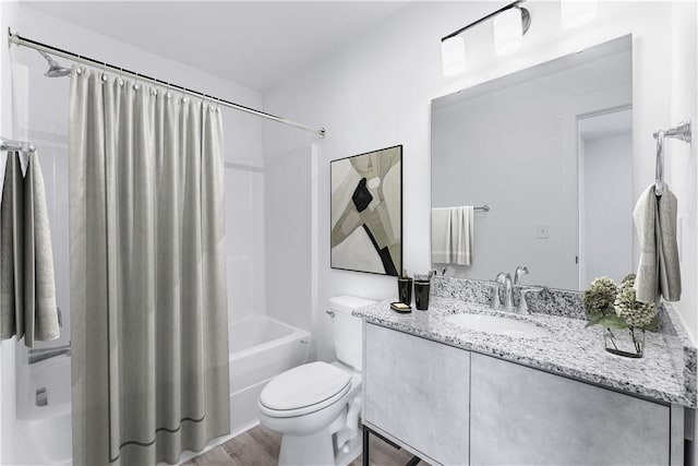 841 States Ave, Bentonville, AR 72713 - full bath with shower / bath combo with shower curtain, vanity, toilet, and wood finished floors