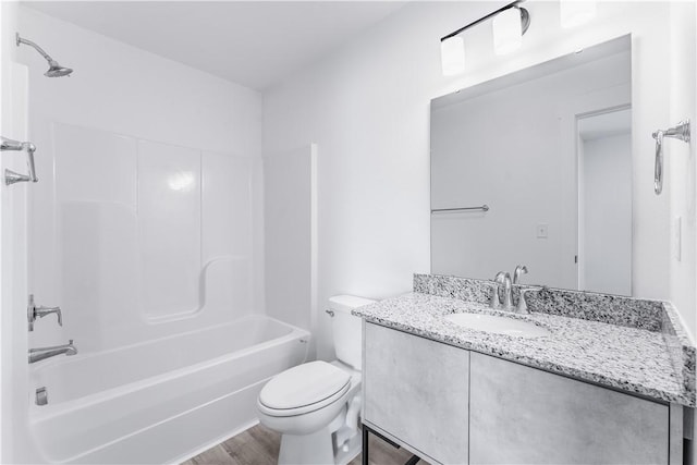 841 States Ave, Bentonville, AR 72713 - bathroom featuring toilet, vanity, shower / washtub combination, and wood finished floors