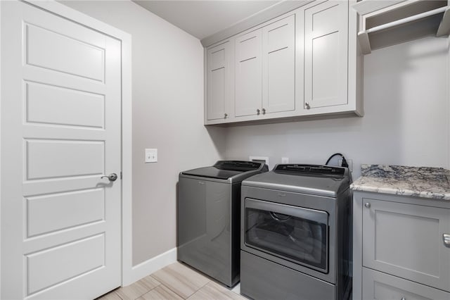 531 Chaparral St, Centerton, AR 72719 - laundry area with cabinet space, independent washer and dryer, and baseboards