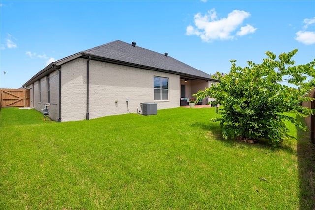 531 Chaparral St, Centerton, AR 72719 - back of house with cooling unit, a patio area, an outdoor living space, and a shingled roof