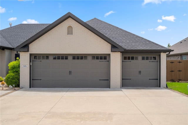 531 Chaparral St, Centerton, AR 72719 - view of front facade featuring brick siding, an attached garage, driveway, and a shingled roof