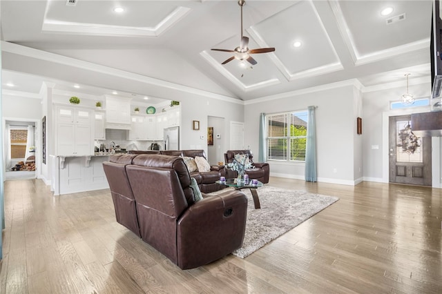 531 Chaparral St, Centerton, AR 72719 - living room with a ceiling fan, light wood-style floors, vaulted ceiling, ornamental molding, and baseboards