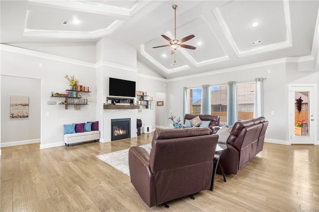 531 Chaparral St, Centerton, AR 72719 - living room featuring a ceiling fan, a glass covered fireplace, light wood-style flooring, beamed ceiling, and baseboards