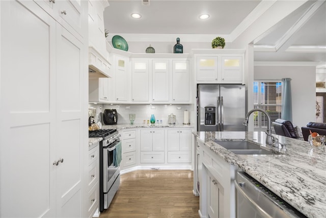 531 Chaparral St, Centerton, AR 72719 - kitchen with appliances with stainless steel finishes, a sink, ornamental molding, white cabinetry, and recessed lighting