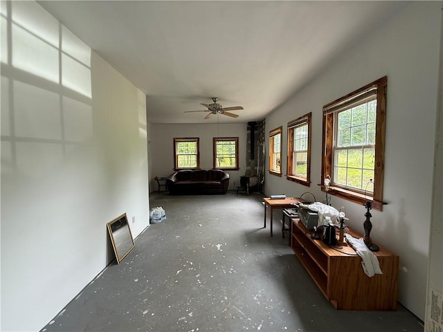 120 Walnut Rdg, Berryville, AR 72616 - living room with unfinished concrete floors and a ceiling fan