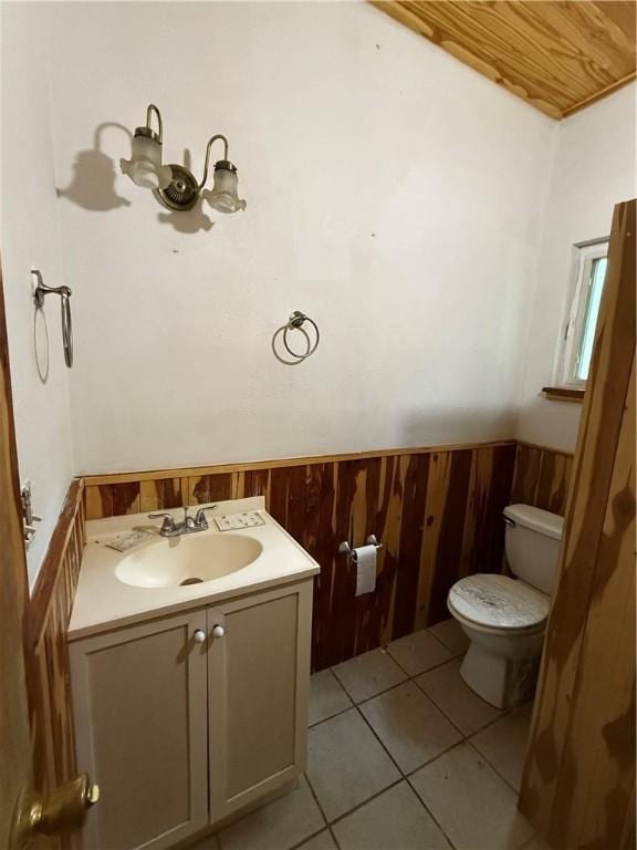 120 Walnut Rdg, Berryville, AR 72616 - bathroom with vanity, wainscoting, tile patterned flooring, and wood walls