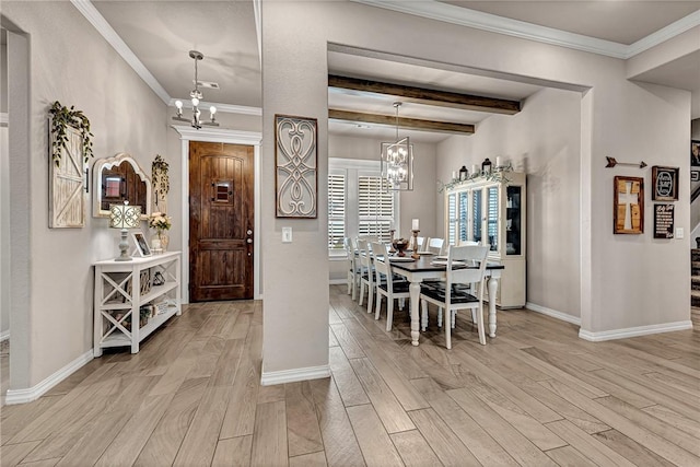 1300 Eureka Rd, Centerton, AR 72719 - dining area with a chandelier, baseboards, light wood-style floors, and beamed ceiling