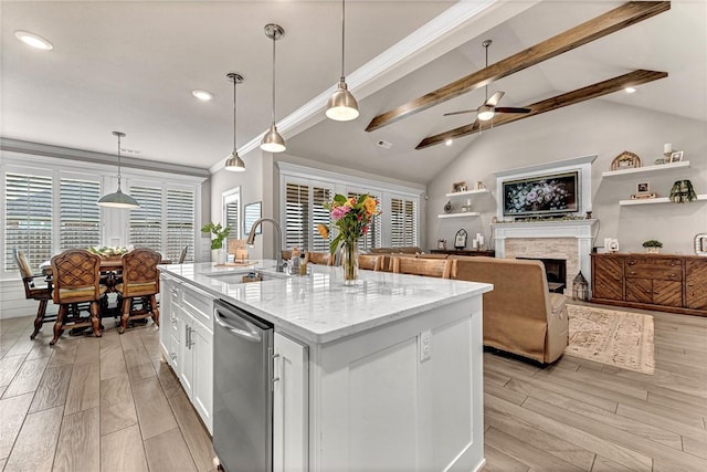 1300 Eureka Rd, Centerton, AR 72719 - kitchen featuring a sink, stainless steel dishwasher, light wood-type flooring, white cabinets, and a fireplace