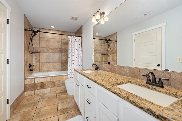 6108 SW Lee Ln, Bentonville, AR 72713 - bathroom with tiled shower / bath, double vanity, toilet, tile patterned floors, and recessed lighting