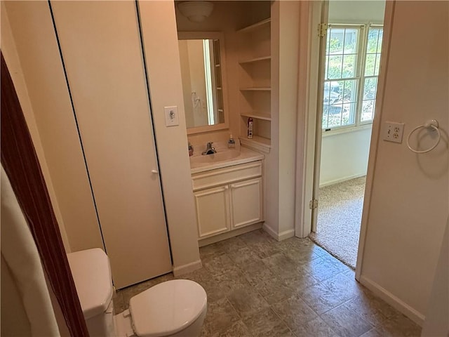 7 Bobwhite Ln, Holiday Island, AR 72631 - bathroom featuring toilet, vanity, and baseboards