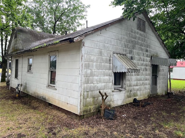 106 E Main St, Ozark, AR 72949 - view of side of home featuring roof with shingles