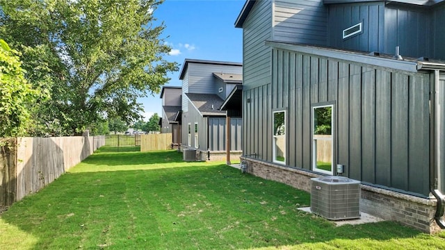 1209 SW Journey Ln, Bentonville, AR 72713 - rear view of house featuring board and batten siding and a fenced backyard