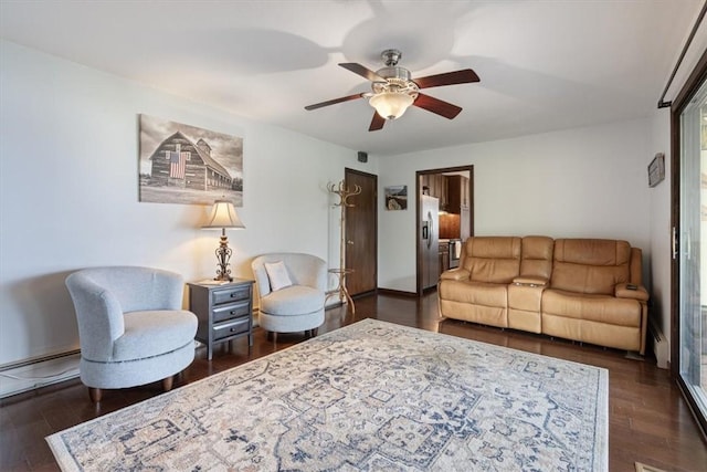326 Hillcrest Rd, Eureka Springs, AR 72631 - living room featuring a ceiling fan and dark wood-style flooring