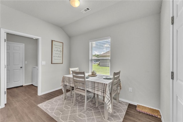 944 Maddy St, Elkins, AR 72727 - dining space featuring wood finished floors and vaulted ceiling