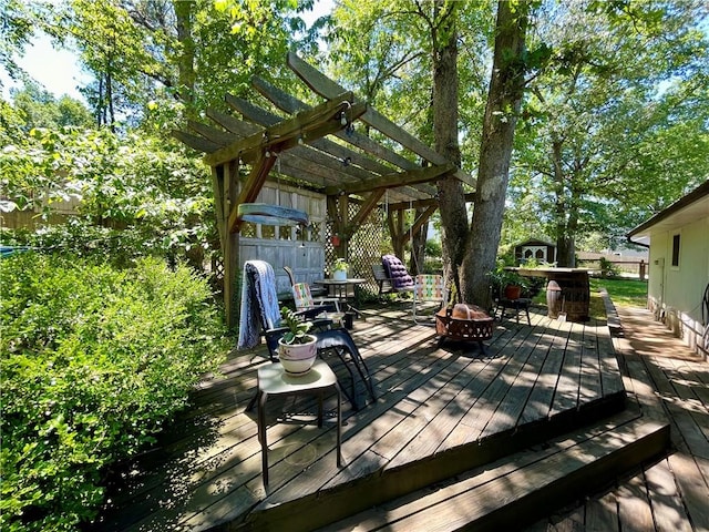 900 Dogwood St, Huntsville, AR 72740 - wooden deck with an outdoor fire pit and a pergola