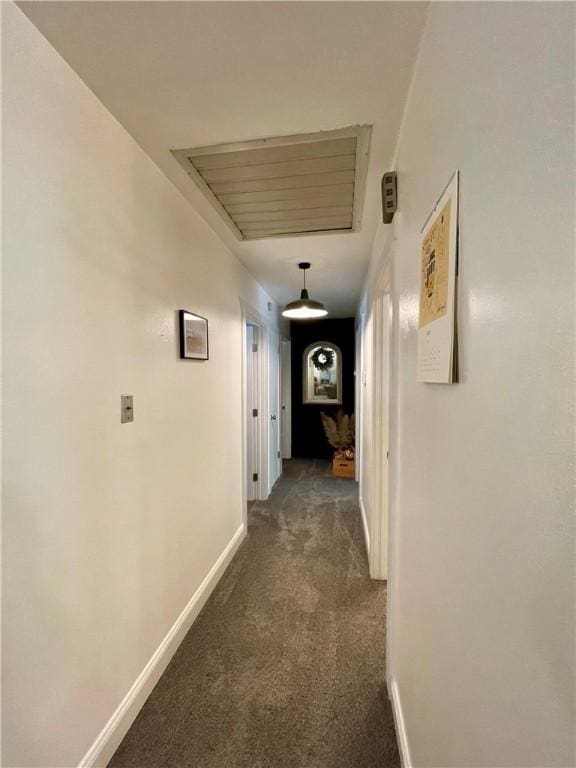900 Dogwood St, Huntsville, AR 72740 - corridor with dark colored carpet and baseboards
