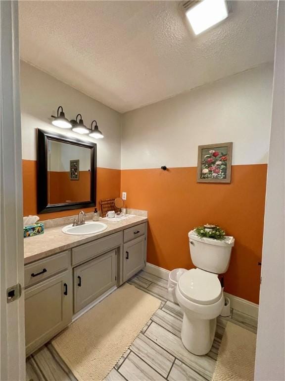 900 Dogwood St, Huntsville, AR 72740 - half bathroom featuring vanity and a textured ceiling