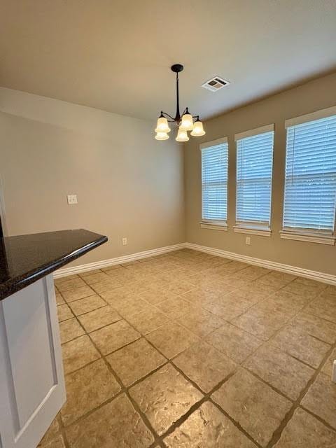 108 Hoss St, Centerton, AR 72719 - unfurnished dining area featuring light tile patterned floors, a chandelier, and baseboards