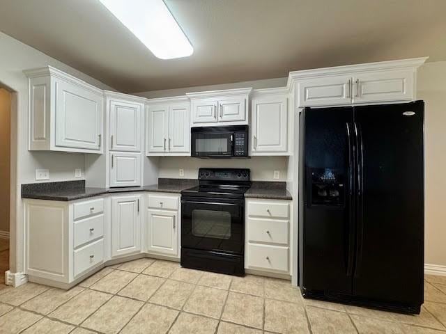 108 Hoss St, Centerton, AR 72719 - kitchen featuring black appliances, dark countertops, white cabinets, and light tile patterned flooring