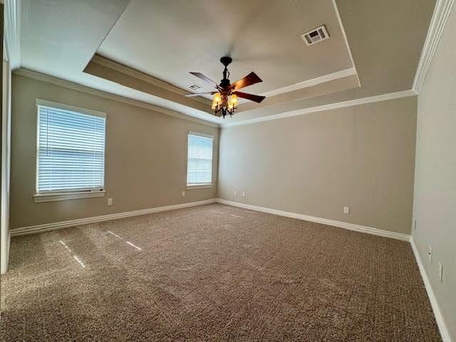 108 Hoss St, Centerton, AR 72719 - unfurnished room with a tray ceiling, crown molding, a ceiling fan, carpet flooring, and baseboards