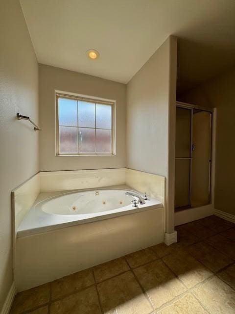 108 Hoss St, Centerton, AR 72719 - full bathroom featuring a stall shower, a whirlpool tub, tile patterned flooring, and baseboards