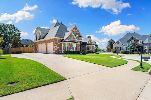 5304 S Promontory Ct, Rogers, AR 72758 - view of front of home featuring driveway and brick siding