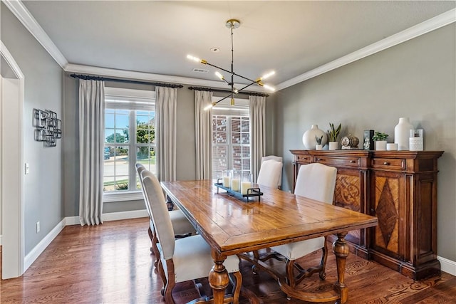 5304 S Promontory Ct, Rogers, AR 72758 - dining room with crown molding, a chandelier, and wood finished floors