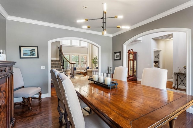5304 S Promontory Ct, Rogers, AR 72758 - dining room with arched walkways, dark wood-style flooring, crown molding, stairs, and a chandelier
