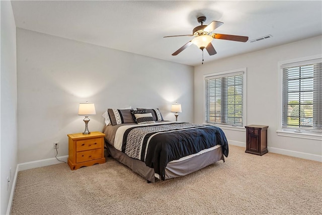 5304 S Promontory Ct, Rogers, AR 72758 - bedroom with multiple windows, light colored carpet, and ceiling fan