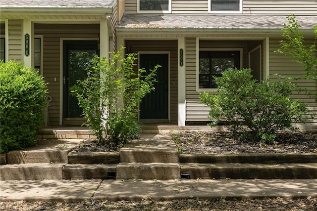500 Fairway Cir, Springdale, AR 72764 - view of exterior entry featuring a porch and roof with shingles