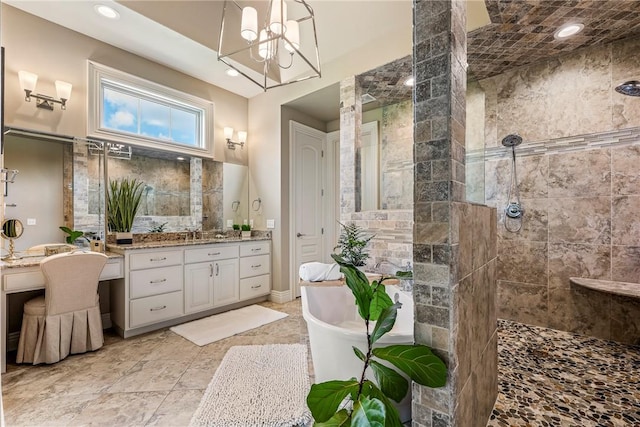 5500 SW Gunstock Rd, Bentonville, AR 72713 - full bathroom with a soaking tub, vanity, a walk in shower, a chandelier, and recessed lighting