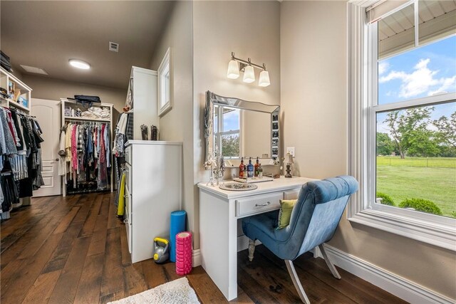 5500 SW Gunstock Rd, Bentonville, AR 72713 - bathroom featuring hardwood / wood-style floors, a walk in closet, and vanity