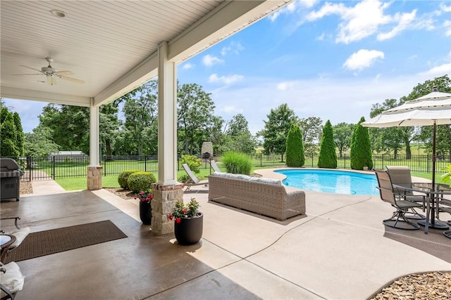 5500 SW Gunstock Rd, Bentonville, AR 72713 - view of swimming pool with a patio, ceiling fan, a grill, and view of scattered trees