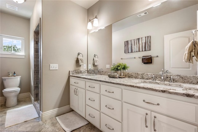 5500 SW Gunstock Rd, Bentonville, AR 72713 - bathroom featuring double vanity, toilet, a stall shower, and baseboards