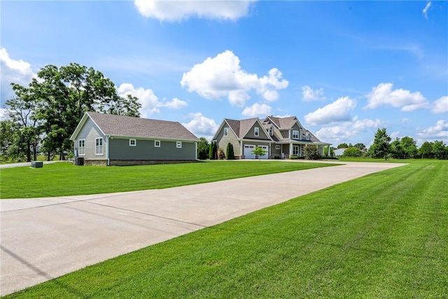 5500 SW Gunstock Rd, Bentonville, AR 72713 - view of front of property featuring a front lawn and concrete driveway