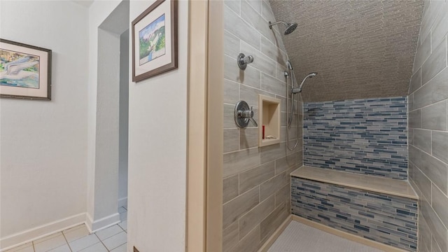 5 Alexander St, Eureka Springs, AR 72632 - bathroom featuring tiled shower, tile patterned floors, and tile walls