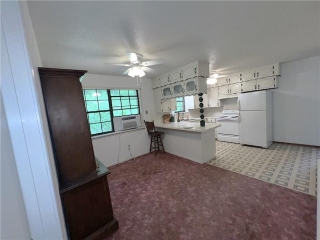 321 F Hwy, Anderson, MO 64831 - kitchen featuring white appliances, a sink, a peninsula, and plenty of natural light