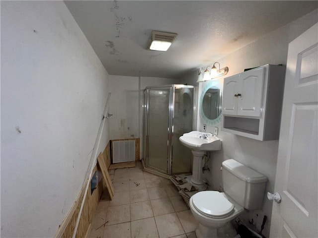 321 F Hwy, Anderson, MO 64831 - full bathroom featuring toilet, a shower stall, tile patterned flooring, and a sink