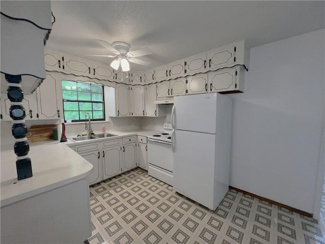 321 F Hwy, Anderson, MO 64831 - kitchen with white appliances, a sink, ceiling fan, under cabinet range hood, and light countertops