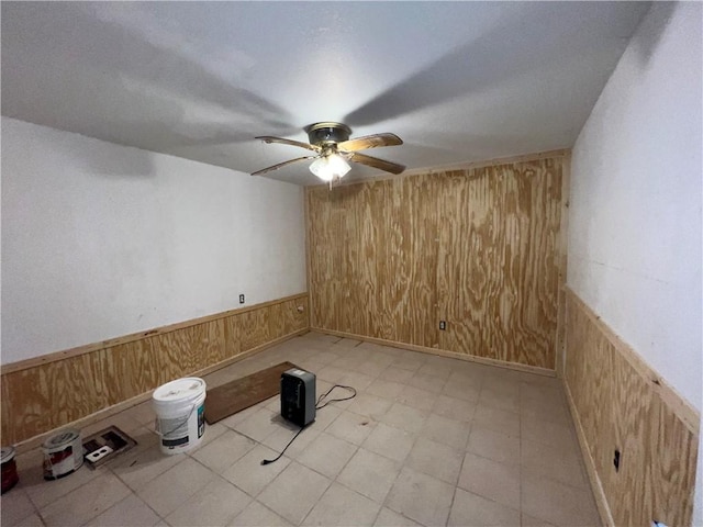 321 F Hwy, Anderson, MO 64831 - unfurnished room with wooden walls, ceiling fan, and a wainscoted wall