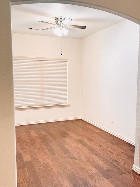 1117 Nemett Dr, Pea Ridge, AR 72751 - unfurnished room featuring ceiling fan, wood finished floors, and baseboards